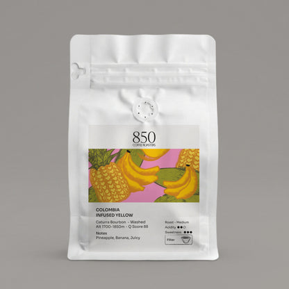 Colombia Infused Yellow whole bean coffee in a white 850 Coffee Roasters bag