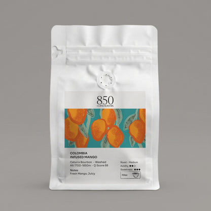 Colombia Infused Mango whole bean coffee in a white 850 Coffee Roasters bag